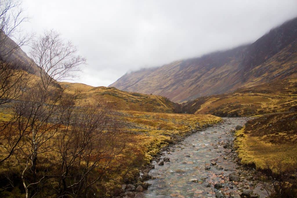 Looking for the perfect day trip from Edinburgh? If you want to see filming locations from Outlander and Harry Potter, witness the beauty of the mountains of Glencoe, and hunt for the Loch Ness Monster, read on about my experience touring the Scottish Highlands with Rabbie's Tours!