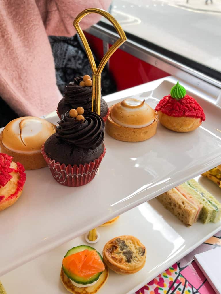 Looking for a truly unique experience while in London? How about afternoon tea while riding on a vintage double-decker bus? Read all about my fun experience on B-Bakery's bus tour! #london #afternoontea #england #bustour #europe #travel