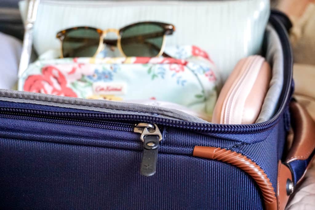 Looking for easy packing tips and ideas on how to save money by traveling with a carry-on only? Check out this helpful guide by a frequent traveler! #carryon #travel #travelpro #luggage #traveltips